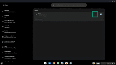 The arrow next to the Wi-FI network name in Settings highlighted.